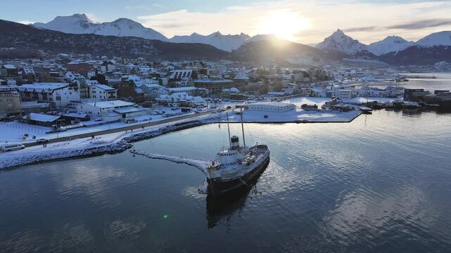 Saint Christopher Boat In Ushuaia Tierra Del Fuego Argentina. Aerial View Of A Bustling Downtown Cityscape With Modern Buildings. Sunset Nature Travel Sunrise Mountain. Nature Outside.