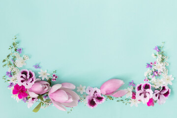 pink and white spring flowers on green background