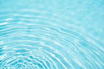 Ripples on turquoise pool water surface