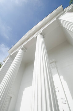 Low angle view of white ionic columns of public library "The Atheneum"