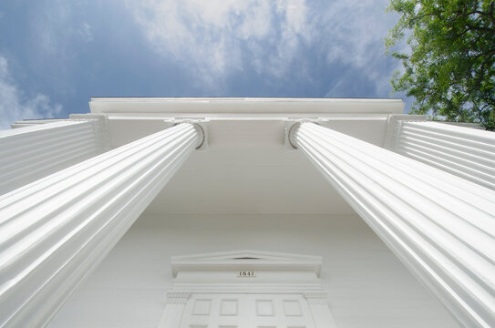 Low angle view of white ionic columns of public library "The Atheneum"