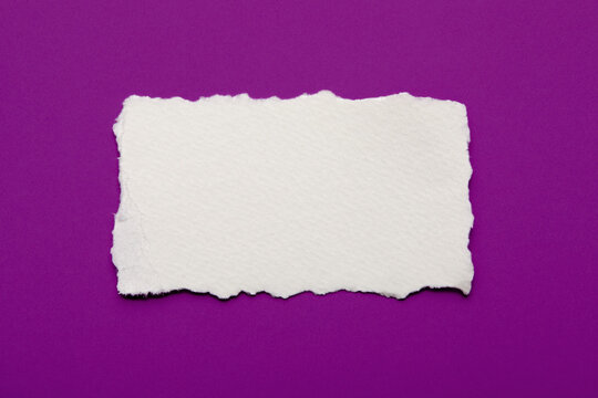 Torn paper on purple background