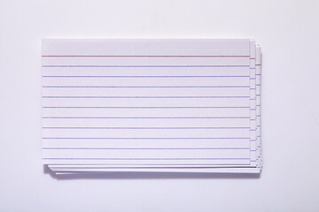 Studio shot of stack of index cards on white background