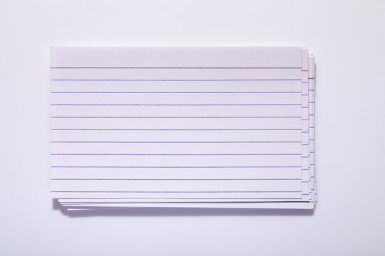 Studio shot of stack of index cards on white background