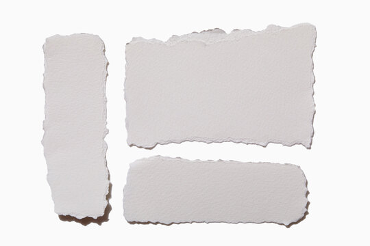 Torn white paper on white background