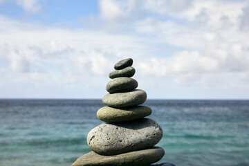 Stack of stones with ocean background
