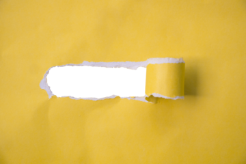 yellow paper torn in the middle with a transparent empty space