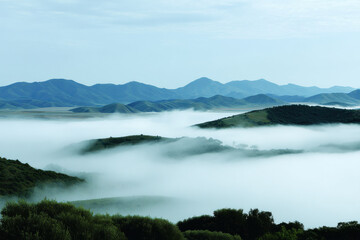 Obraz premium breathtaking view of palmare mountain enveloped in light fog creating serene atmosphere