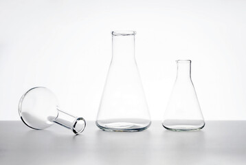 laboratory flasks on a table on a white background