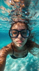 Fototapeta premium Underwater Selfie: A Girl's Serene Submerged Moment
