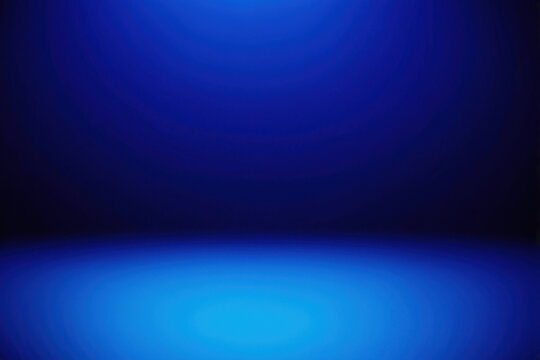 A blurry blue background featuring a central light source