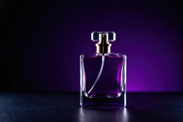 Perfume bottle on a purple surface, ready for use