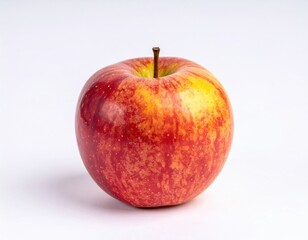 Red and yellow apple showcasing a glossy skin and inviting appearance against a plain background