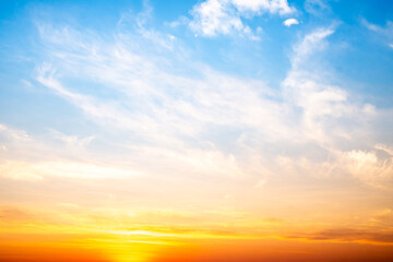 Obraz premium Beautiful , luxury soft gradient orange gold clouds and sunlight on the blue sky perfect for the background, take in evening,Twilight, Large size, high definition landscape photo