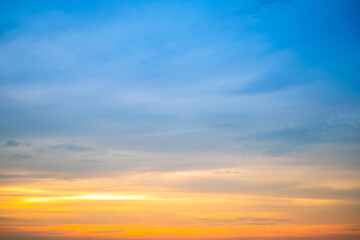 Obraz premium Beautiful , luxury soft gradient orange gold clouds and sunlight on the blue sky perfect for the background, take in evening,Twilight, Large size, high definition landscape photo