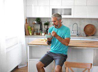 kitchen food man healthy morning mature breakfast active fitness diet home healthy senior adult ...