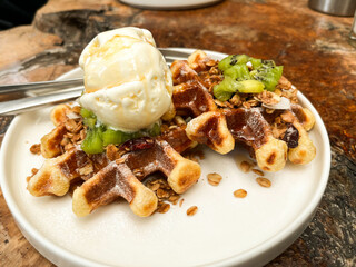 Close-Up of Sweet Waffle Dessert with Kiwi and Ice Cream