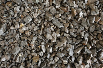 Nickel mine, mining. Background concept with flat lay of pentlandite ore. Rocks, textured. Used in alloys such as stainless steel, nickel-cadmium rechargeable batteries, coins