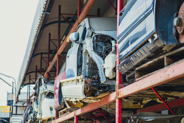 garage scrapyard, old used vehicle spare part engine block car body parts storage for recycle or repair for sale