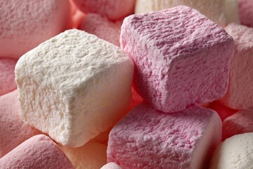 Colorful marshmallows in various shapes and shades arranged closely together during a festive celebration