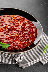 Chile con carne plate beans, tomato, corn, meat fresh delicious gourmet food background on the table rustic food top view copy space