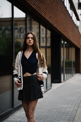 Young pretty beautiful woman, student walking