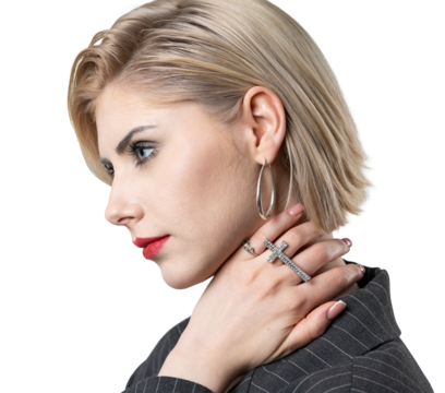 Portrait of a seductive, stylish business lady in the studio. Blonde girl in a suit and top.