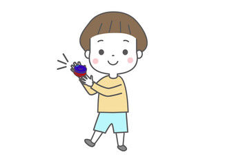 笑顔でカスタネットをたたいている子ども