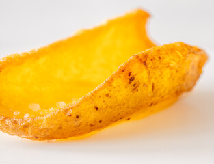 Single crispy potato dipper isolated against bright white background, fried to perfection