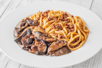 Unagi udon noodles served with beef and crispy garlic thyme shiitake