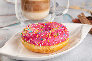 Sweet donut with strawberry icing