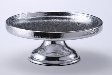 Elegant metal cake stand perfect for displaying desserts at special occasions and celebrations