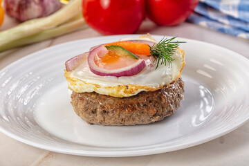 Beefsteak chop with roasted egg