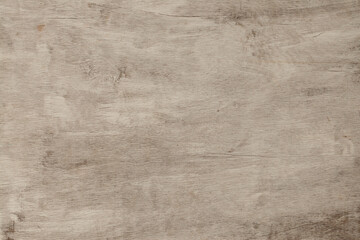 Lightly textured wooden surface with natural grain patterns in a neutral shade