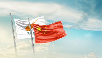Cyprus and China flags waving in beautiful sky. Two country flag for agreement or deal. Cyprus...