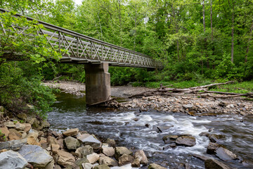 bridge in the forrest over stream