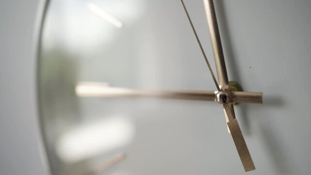 Time management and scheduling concept. Close-up wall clock showing 9.00 or 21.00 o'clock on white