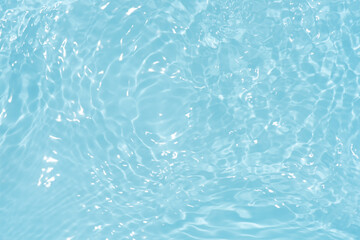 Blue water with ripples on the surface. Defocus blurred transparent blue colored clear calm water...