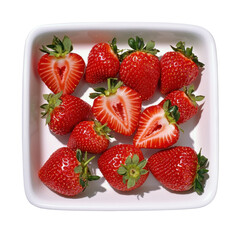 Fresh Red Strawberries with Heart-Shaped Patterns Displayed on a White Plate Surrounded by Green Leaves and Natural Light Transparent background, PNG