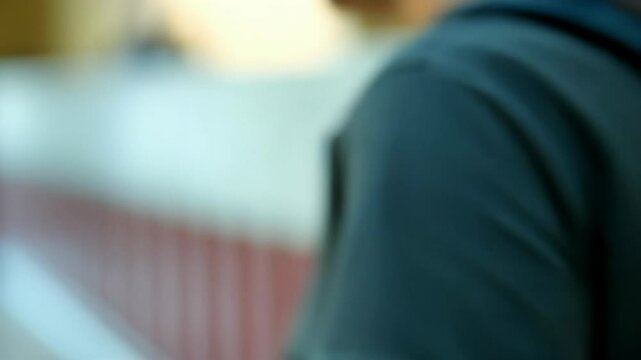 Close-up of zipper transitioning to student entering school hallway with backpack