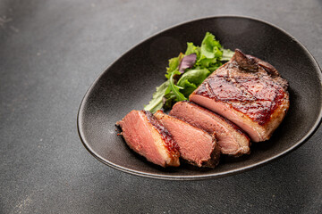 Duck breast roast meat poultry fresh delicious gourmet food background on the table rustic food top view copy space