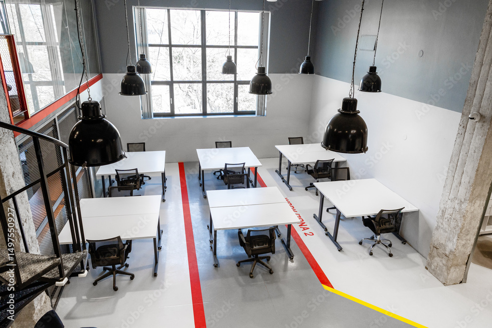 Poster modern workspace with multiple desks and large windows creating a bright atmosphere for collaboratio