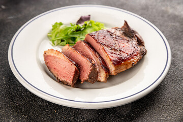 Duck breast roast meat poultry fresh delicious gourmet food background on the table rustic food top view copy space