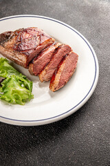 Duck breast roast meat poultry fresh delicious gourmet food background on the table rustic food top view copy space