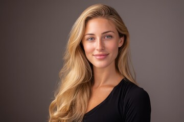 Naklejka premium female professional headshot, warm lighting, neutral tones, studio background