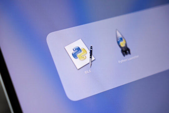 Poznan, Poland - May 15, 2025: IDLE Python environment application icon prominently displayed on an Apple macOS screen, representing code development and learning