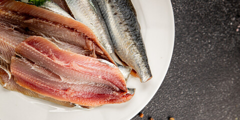 Sardine raw fish fillet seafood anchovy filet fresh delicious gourmet food background on the table rustic food top view copy space pescetarian diet © Alesia Berlezova
