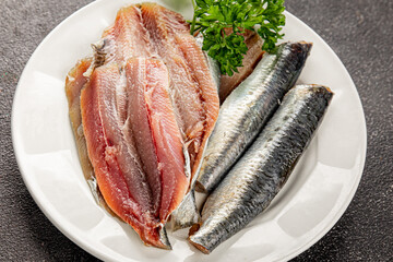 Sardine raw fish fillet seafood anchovy filet fresh delicious gourmet food background on the table rustic food top view copy space pescetarian diet