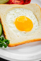 Fried gashouse eggs in bread egg in the basket delicious snack breakfast in a bowl fresh delicious gourmet food background on the table rustic food top view copy space