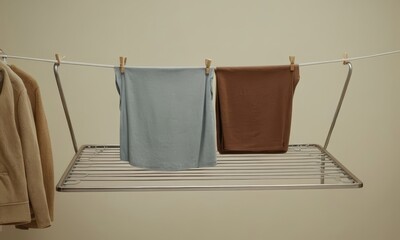 Clothes drying on a rack, emphasizing minimalist and sustainable living concepts